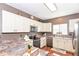 Modern kitchen featuring stainless steel appliances, updated countertops, and ample cabinet space at 3147 Bonham Dr, Indianapolis, IN 46222