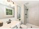 Updated bathroom with modern vanity, framed mirror, and tiled walk-in shower at 317 Heritage Ct, Fishers, IN 46038