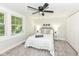 Cozy bedroom with neutral decor, a plush bed, and large bright windows at 317 Heritage Ct, Fishers, IN 46038