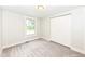 Well-lit bedroom featuring plush carpeting and a large window offering green views at 317 Heritage Ct, Fishers, IN 46038