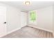 Clean, modern bedroom with closet, updated trim, carpet and natural light at 317 Heritage Ct, Fishers, IN 46038