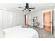 Light filled bedroom with a ceiling fan, closet, and an attached bathroom at 317 Heritage Ct, Fishers, IN 46038