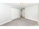 Spacious bedroom with plush carpeting, closet, and connecting doorframe at 317 Heritage Ct, Fishers, IN 46038