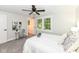 Bright bedroom featuring large windows with natural light and a sitting area at 317 Heritage Ct, Fishers, IN 46038