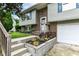 Charming front of a two-story home with a brick facade, a tidy yard, and a two-car garage at 317 Heritage Ct, Fishers, IN 46038