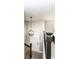 Bright foyer with a modern chandelier, a white front door, and a staircase with black railings at 317 Heritage Ct, Fishers, IN 46038