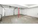 Three-car garage with concrete floors, and plenty of room for parking or storage at 317 Heritage Ct, Fishers, IN 46038