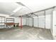 Open garage features concrete floors, storage, and access to one of three garage doors at 317 Heritage Ct, Fishers, IN 46038