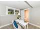 Finished basement office featuring bright windows and a view to the nearby half bath at 317 Heritage Ct, Fishers, IN 46038
