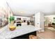 Open-concept kitchen featuring white cabinets, stainless steel appliances, and a large island with bar seating at 317 Heritage Ct, Fishers, IN 46038