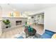 Finished basement living area includes a fireplace, bright windows, and desk space at 317 Heritage Ct, Fishers, IN 46038