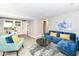 Finished basement living area with light gray floors, modern furniture, and bright natural light at 317 Heritage Ct, Fishers, IN 46038