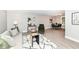 Inviting living room with modern decor, stylish furniture, and a seamless flow into the dining area at 317 Heritage Ct, Fishers, IN 46038