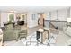 Open-concept living area flowing into the dining and kitchen areas, filled with natural light at 317 Heritage Ct, Fishers, IN 46038