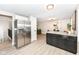 Living space featuring stainless steel refrigerator, kitchen island and view into a living space at 317 Heritage Ct, Fishers, IN 46038