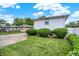 Backyard view showing a well maintained lawn with trimmed shrubbery at 3322 N Riley N Ave, Indianapolis, IN 46218