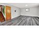 A finished basement with gray flooring and an egress window at 3322 N Riley N Ave, Indianapolis, IN 46218