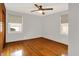 A bedroom with hardwood floors and two windows at 3322 N Riley N Ave, Indianapolis, IN 46218