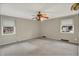 This bedroom has gray carpet and two windows at 3322 N Riley N Ave, Indianapolis, IN 46218