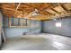 Spacious garage features exposed wood beams, concrete flooring, and block wall construction at 3322 N Riley N Ave, Indianapolis, IN 46218