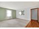 Bright living room with a large window and plush carpet flooring at 3322 N Riley N Ave, Indianapolis, IN 46218