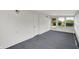 Cozy sunroom with white walls, carpeted floors, and plenty of natural light at 3322 N Riley N Ave, Indianapolis, IN 46218