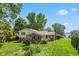 The backyard is spacious with a lush green lawn and mature trees at 3388 S Leonard Rd, New Palestine, IN 46163