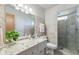 Bathroom with neutral tile, granite vanity, and glass shower, providing modern features at 3388 S Leonard Rd, New Palestine, IN 46163