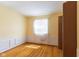 Bedroom featuring wood floor, window, and base-molding at 3388 S Leonard Rd, New Palestine, IN 46163