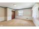 Carpeted bedroom with wallpaper, white trim and a large closet at 3388 S Leonard Rd, New Palestine, IN 46163
