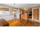 Bright kitchen with wood cabinets, wood flooring, and modern lighting at 3388 S Leonard Rd, New Palestine, IN 46163