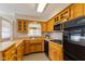 Bright kitchen featuring wooden cabinets, modern appliances, and ample counter space at 3388 S Leonard Rd, New Palestine, IN 46163