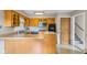 Well-equipped kitchen with wooden cabinets, stainless steel appliances, and functional layout at 3388 S Leonard Rd, New Palestine, IN 46163
