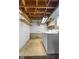 Functional laundry room with washer, dryer, and open shelving for storage at 3388 S Leonard Rd, New Palestine, IN 46163