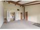 Inviting living room features beamed ceilings and an open floor plan at 3388 S Leonard Rd, New Palestine, IN 46163