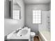 Bathroom with a sink and a tub with a shower at 4034 N Temple Ave, Indianapolis, IN 46205