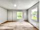 Bright, freshly painted living room with new wood flooring and ample natural light at 4034 N Temple Ave, Indianapolis, IN 46205