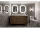 This bathroom features a double vanity sink with modern lighting and a toilet at 4245 Norwaldo Ave, Indianapolis, IN 46205
