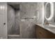 Bathroom features a marble tile shower, heated towel rack, and modern vanity sink at 4245 Norwaldo Ave, Indianapolis, IN 46205