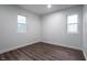 This bedroom features hardwood floors, white trim, and natural light from the windows at 4245 Norwaldo Ave, Indianapolis, IN 46205