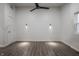 This bedroom features a ceiling fan, hardwood floors, and modern lighting fixtures at 4245 Norwaldo Ave, Indianapolis, IN 46205
