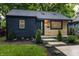 Well-maintained home with dark wood, eye-catching light wood accents, and manicured landscaping at 4245 Norwaldo Ave, Indianapolis, IN 46205
