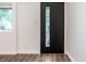 A bright, modern foyer featuring clean lines, sleek trim, and durable wood-look floors at 4245 Norwaldo Ave, Indianapolis, IN 46205