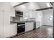 Bright kitchen with stainless steel appliances, light countertops, and lots of storage space at 4245 Norwaldo Ave, Indianapolis, IN 46205
