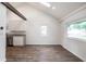 Spacious living room showcasing open-concept design, hardwood floors, and a modern kitchen at 4245 Norwaldo Ave, Indianapolis, IN 46205