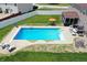 Aerial view of the backyard pool with lounge seating at 5063 Haywood Ln, Plainfield, IN 46168
