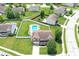 Aerial view of brick home with an in-ground backyard pool in a fenced yard at 5063 Haywood Ln, Plainfield, IN 46168
