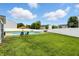 Spacious backyard featuring an inground pool, pristine lawn, and privacy fence, great for entertaining at 5063 Haywood Ln, Plainfield, IN 46168
