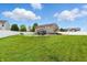 Expansive backyard featuring in-ground pool, patio furniture, and lush greenery at 5063 Haywood Ln, Plainfield, IN 46168