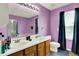 Bathroom with double sinks and updated vanity at 5063 Haywood Ln, Plainfield, IN 46168